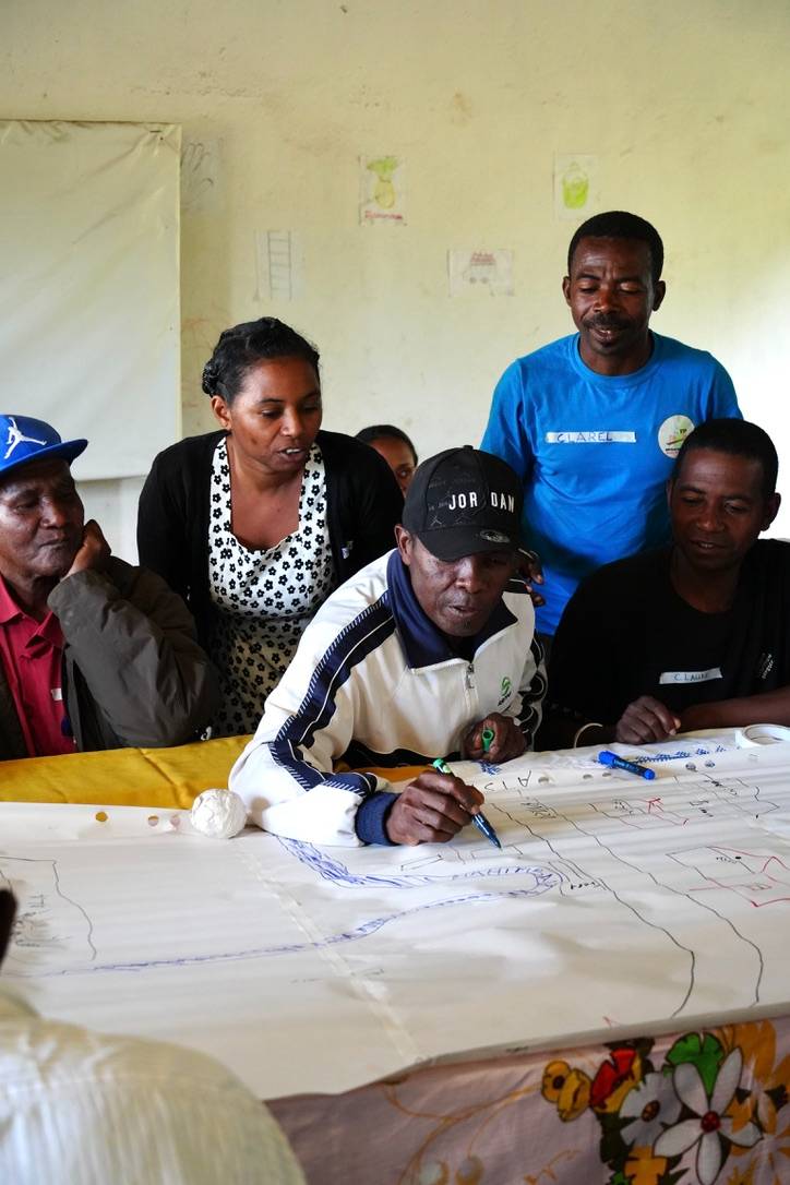 Participants working on the community mapping together.jpeg