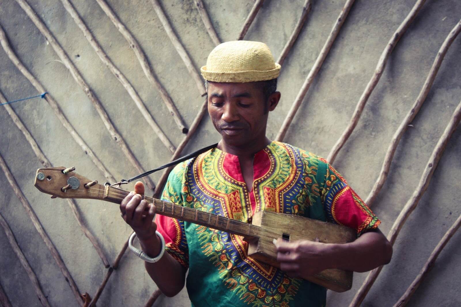 Anosy man playing traditional instrument