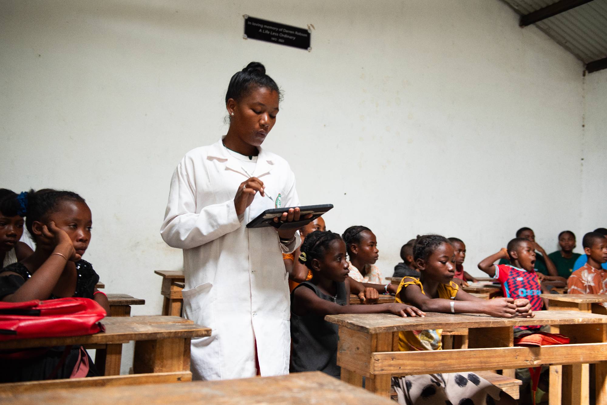 A teacher at Beraketa Primary school using a tablet 