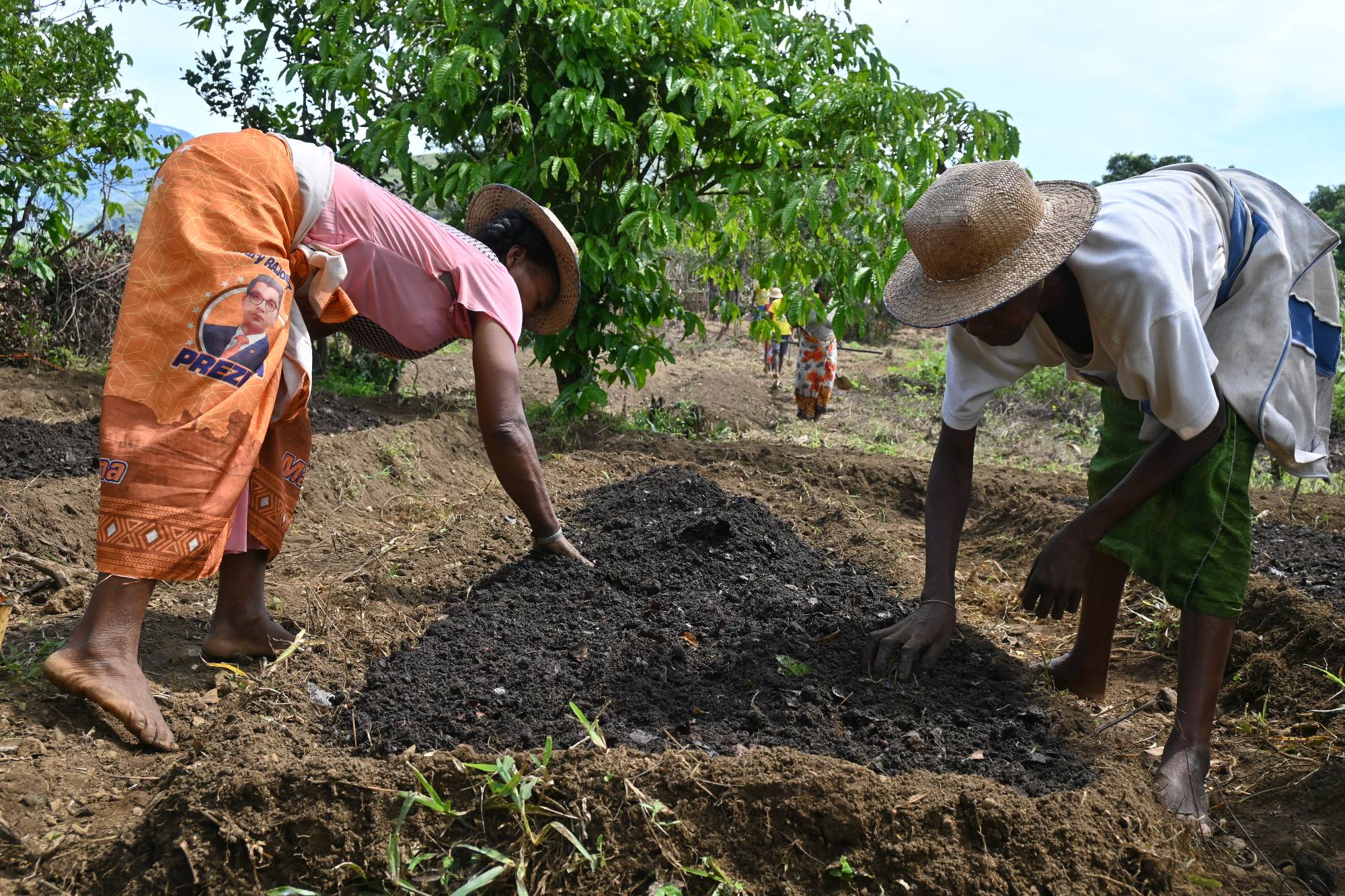Community Planting Leads preparing planting beds at the site