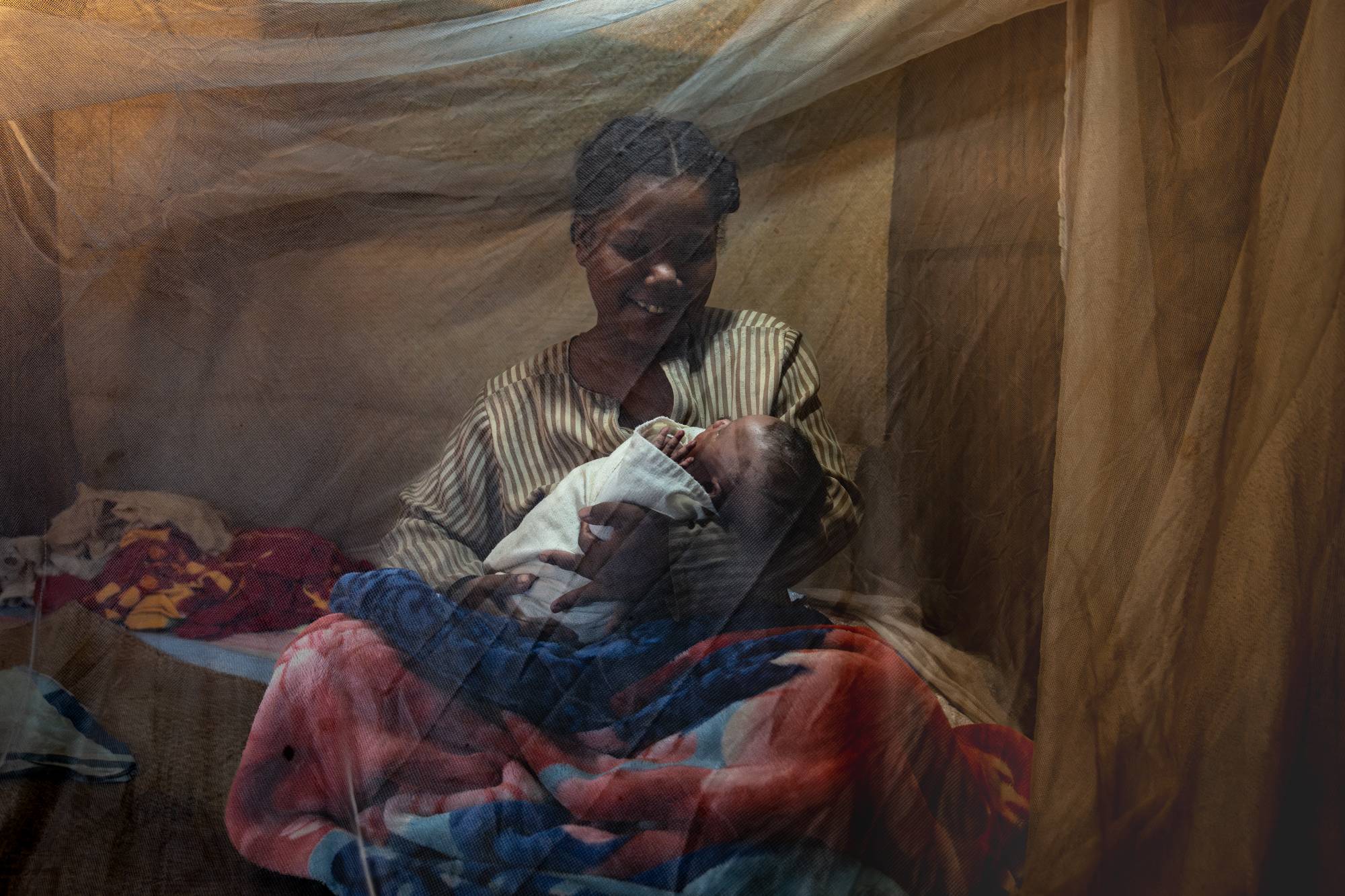 One-month-old Mélanie sleeps peacefully in her mother's arms in Mahatalaky Commune, Anosy, Madagascar