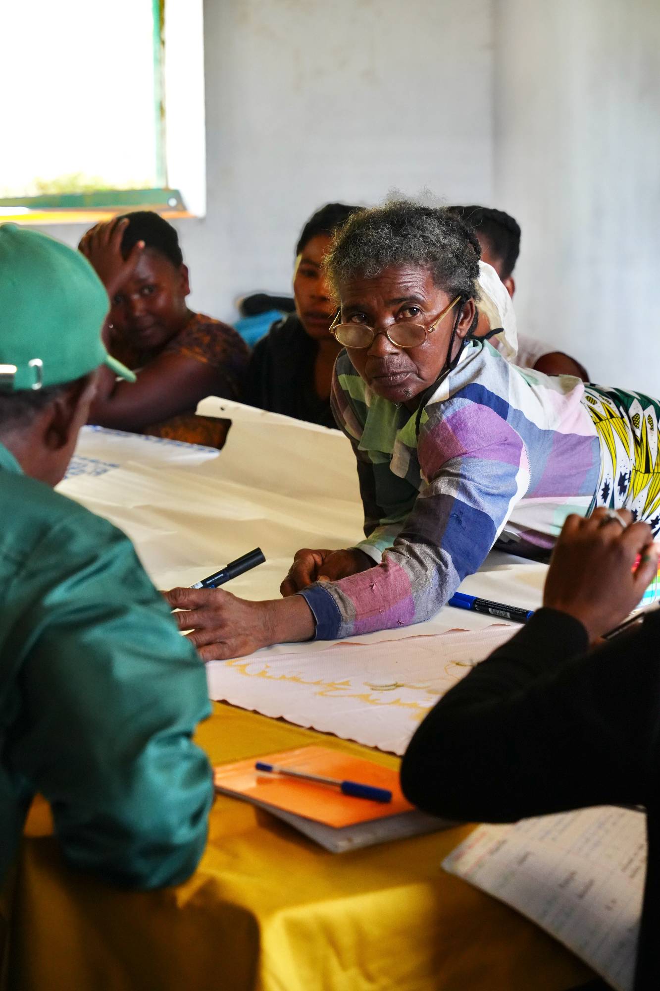 Woman participant working on the community mapping.jpeg